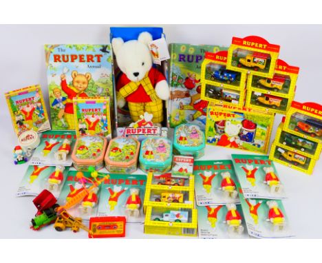 Ertl - Lledo - Others - A mainly boxed collection of Rupert the Bear themed diecast models, toys, annuals, a soft toy and Rup