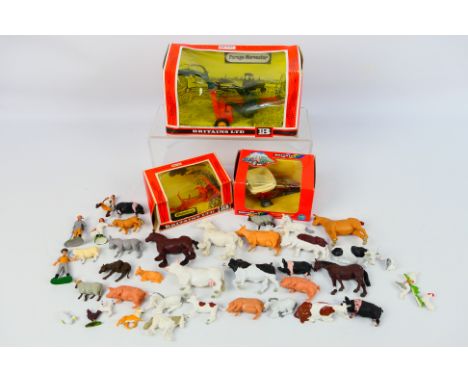Britains - Three boxed Britains 1:32 scale farm implements with a loose collection of Britains farm animals and farm workers.