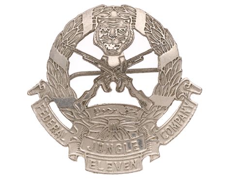 11th Federal Jungle Company Malay head-dress badge c. 1951.  Good rare die-pressed white metal laurel wreath resting on tri-p