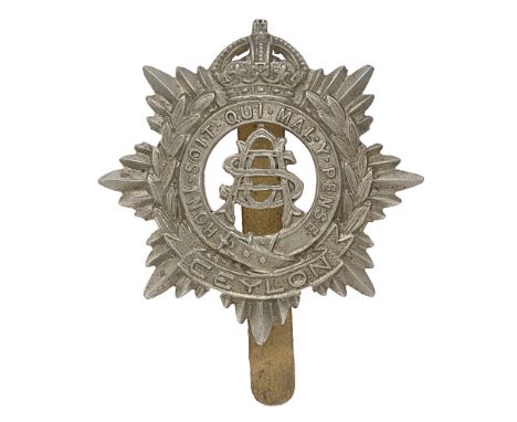 Ceylon Army Service Corps cap badge c. 1918-48. Good scarce British made die-stamped white metal crowned star bearing Garter 