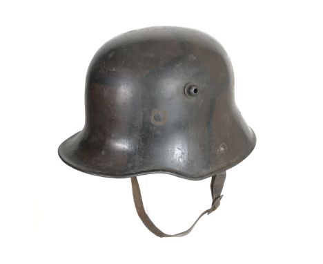 Imperial German WW1 Camouflage Steel Helmet.  A very good and scarce example with original camouflage painted finish to the s