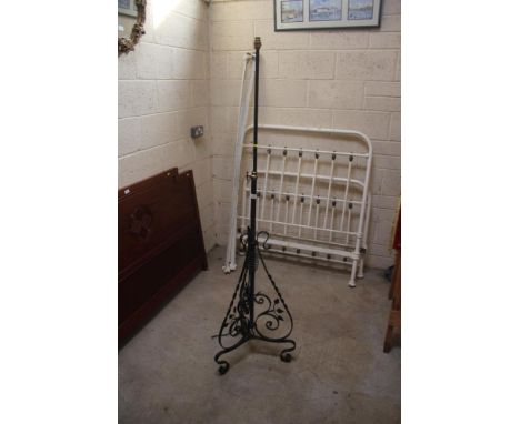 An Edwardian wrought metal and brass mounted telescopic standard lamp (converted)
