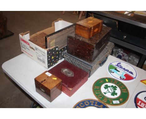 A Victorian mahogany tea caddy (interior missing); a leather stationery box; a vintage suitcase; and two work boxes 