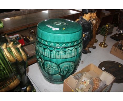 A Chinese green glazed pottery barrel garden seat