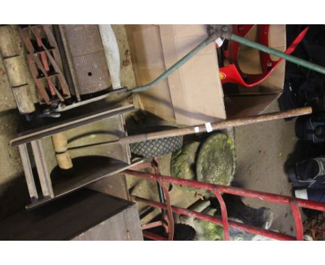 A cake crusher; and a long handled roller 