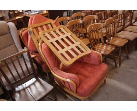A pair of light Ercol easy chairs, with matching stools (one AF)