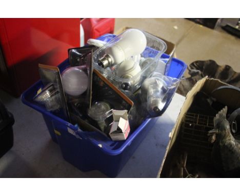 A plastic crate of various light bulbs