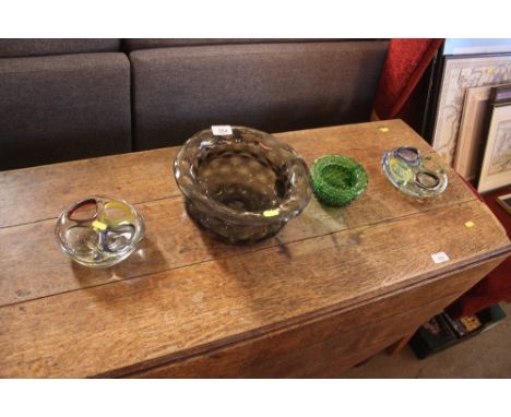 A Whitefriars style dimple glass chamber pot; a dimpled green glass miniature similar; and two Murano style dishes