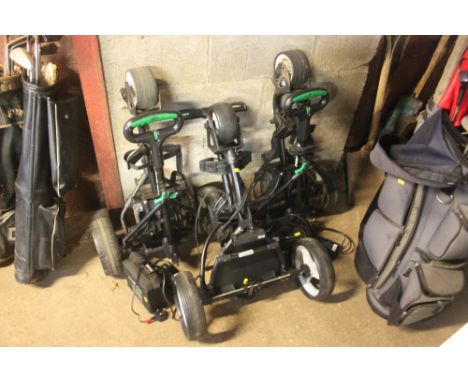 Two Hillbilly electric golf carts; and a manual golf cart