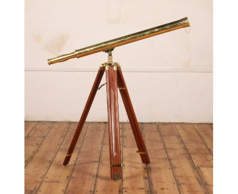 A brass extending telescope, mounted upon a wooden tripod stand, length of telescope, l.98cm