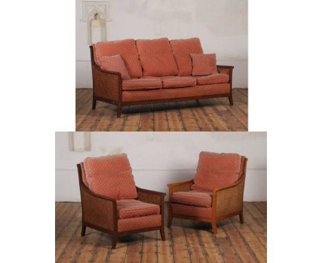 A Parker Knoll three-piece lounge suite, having caned arms, comprising a sofa, 184w x 97d x 92h cm, and two chairs, 75w x 91d