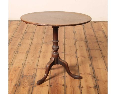 A 19th century oak tripod table, dia. 66cm, h 72cm.