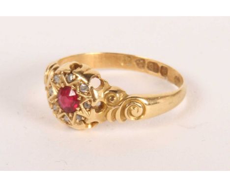 An 18ct gold ruby and diamond cluster ring, 3.3g, size N