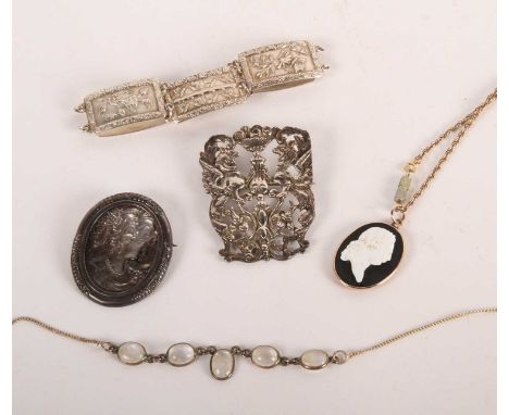 A profile portrait cameo pendant on chain, together with a sterling silver bracelet, marked with K for 1945-46 and LILD for L