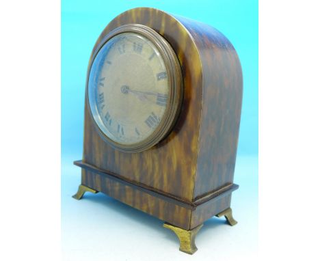 An early 20th Century arch top clock with faux tortoiseshell case and gilt metal feet, the dial marked Geo. H. Webb Ltd., Not