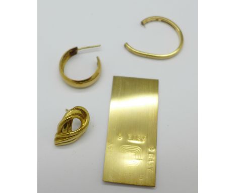 Two 9ct gold earrings and a 9ct gold ring, a/f, (scrap 4.3g) and a yellow metal plaque