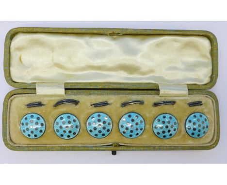 A cased set of sterling silver and blue enamel buttons