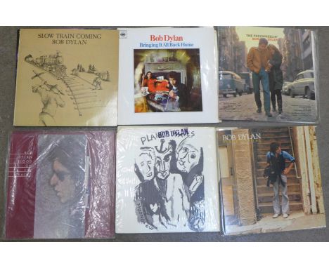 A collection of eleven Bob Dylan LP records including Blood on The Tracks with song book