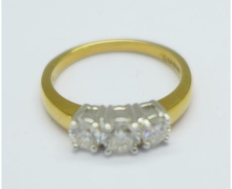 An 18ct gold three stone diamond ring, 3.9g, N, 0.75 carat diamond weight