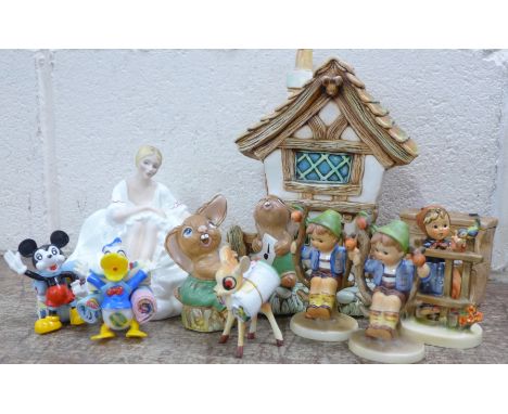 Three Hummel figures including two Apple Tree Boy, two Pendelphin figures with a piano and house, three Disney plastic figure