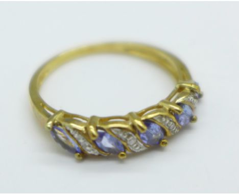 A 9ct gold, tanzanite and diamond ring, 2.2g, P