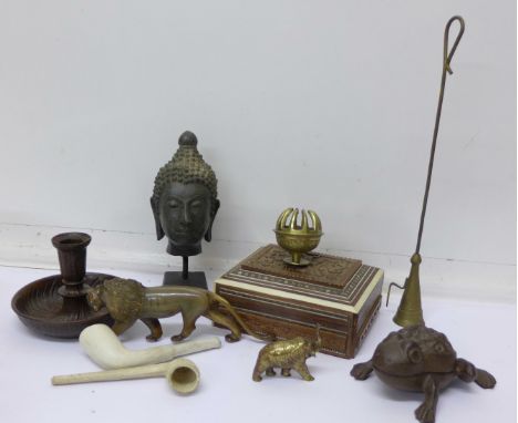 An Indian carved box, a Thai bust, a novelty toad lidded container, candle snuff, candlestick, etc.