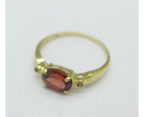 A 9ct gold, garnet and diamond ring, 1.3g, O