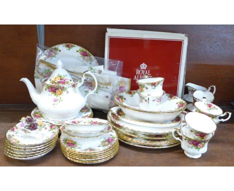 Royal Albert Old Country Roses six setting tea and dinner service; large teapot, pin dishes a table cloth and a boxed cake st