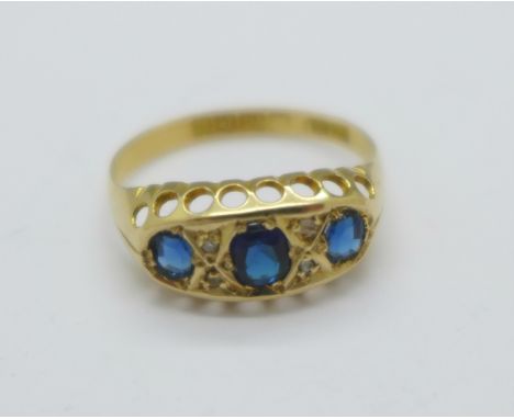 An 18ct gold, seven stone sapphire and diamond ring, Birmingham 1911, 2g, M