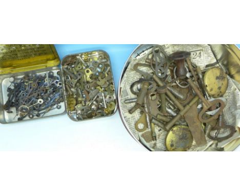 A collection of clock keys, pendulums, hands, etc.
