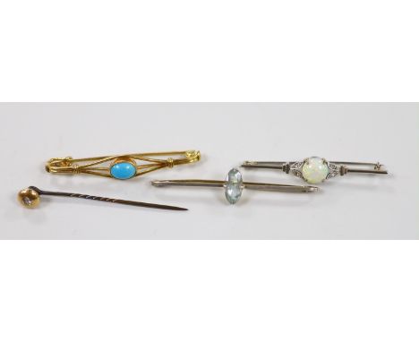 An Edwardian 15ct and single stone aquamarine set bar brooch, 58mm, gross 3.5 grams, two other bar brooches including a 9ct &