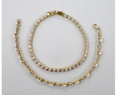 A modern 14k yellow metal and simulated diamond set line bracelet, 18cm and a 14k yellow metal and white opal set line bracel