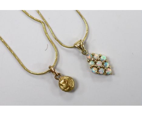 A modern 585 and white opal cluster set diamond shaped pendant, 17mm, on a 14k chain43cm and a yellow metal pendant on a 14kt