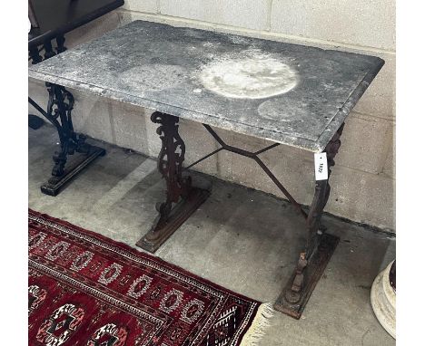 A rectangular cast iron marble topped garden table, length 92cm, depth 54cm, height 69cm