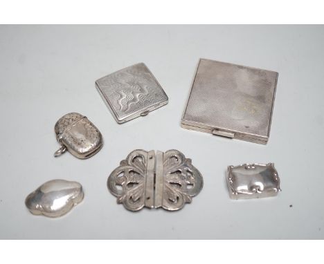 A  George VI engine turned silver compact, 69mm, two modern silver pill boxes, a Persian white metal belt buckle, a silver ve