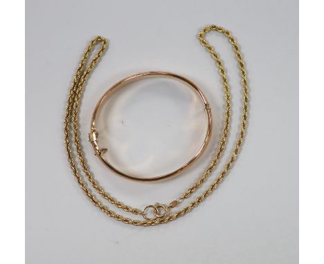 A modern 9ct gold ropetwist chain, 52cm and a 9ct gold hinged bangle, 19.7 grams.