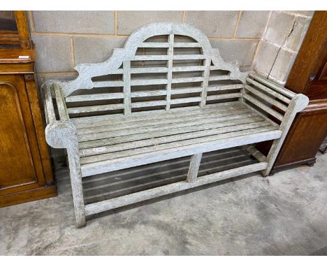 A Lutyens style teak garden bench, length 165cm, depth 64cm, height 101cm
