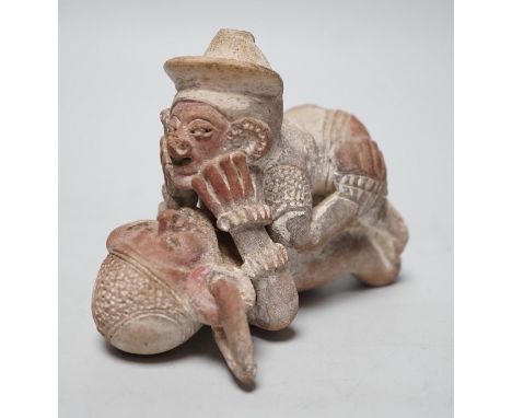 A Mayan or later biscuit earthenware erotic novelty whistle, 12cm long