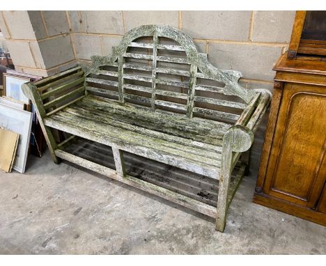 A Lutyens style weathered teak garden bench, length 165cm, depth 64cm, height 101cm