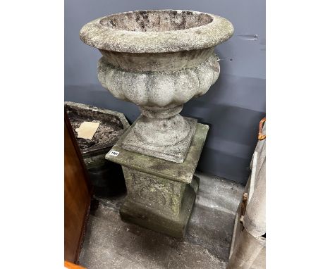 A circular reconstituted stone garden planter on square plinth, diameter 40cm, height 84cm together with an octagonal shallow