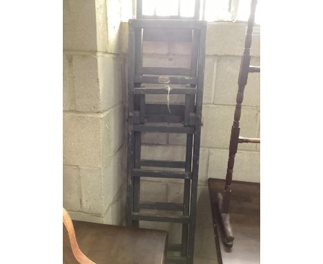 A painted vintage extending ladder.
