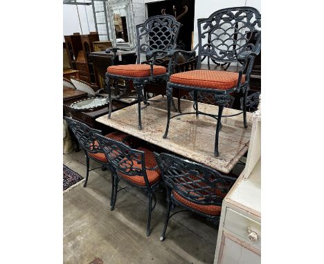 A rectangular cast metal marble topped garden table, length 140cm, depth 100cm, height 75cm and eight chairs with drop in sea