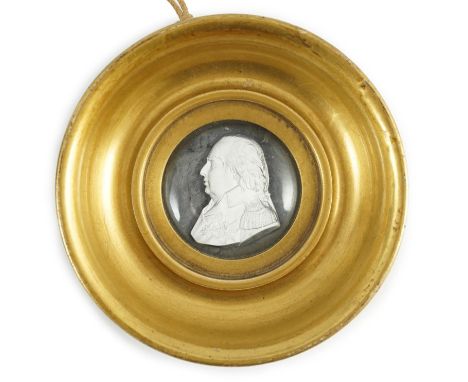 A Louis XVIII glass sulphide portrait plaque, in a gilded porcelain frame, c.1820, the cristallo-ceramie portrait of Louis XV