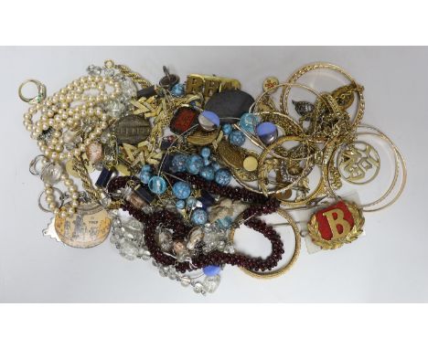 A quantity of assorted costume jewellery and other items including silver and enamel plaque and a garnet bead necklace.