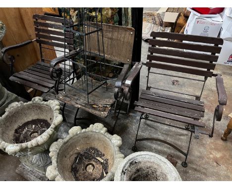 A wrought iron garden growing frame, height 130cm together with three wrought iron folding garden chairs