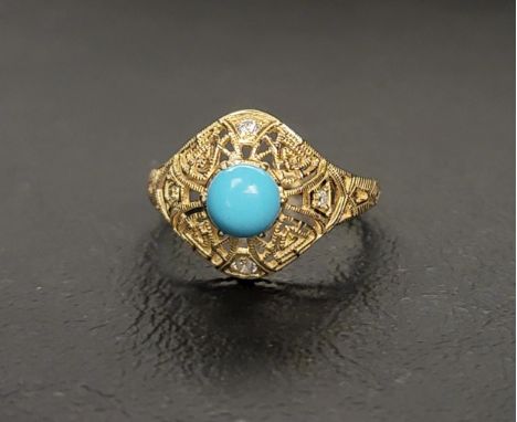 TURQUOISE AND DIAMOND DRESS RINGthe round cut cabochon turquoise in pierced diamond set surround extending down the shoulders