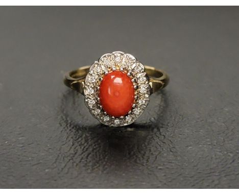 CORAL AND DIAMOND CLUSTER RING the central oval cabochon coral section surrounded by diamonds, on a nine carat gold shank, ri