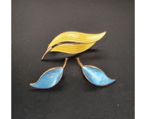 NORWEGIAN ENAMEL DECORATED SILVER GILT LEAF DESIGN BROOCH AND EARRINGScomprising an Aksel Holmsen yellow enamel decorated bro