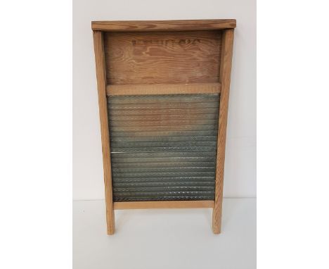 VINTAGE PINE FRAME WASHBOARDwith a serrated glass panel, marked Lewis's, 54.5cm high 