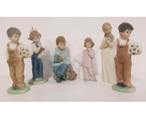 SIX NAO FIGURINESincluding a girl cuddling a puppy, 20cm high, two figurines of boys in dungarees holding a football, 19cm hi